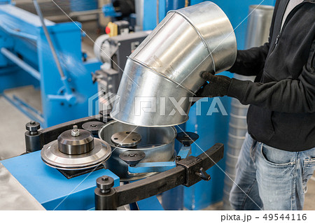 Worker controls the machine. Production rolling tool, electric machine. the production of 49544116
