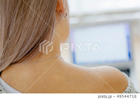 Blond young girl with long hair in a cozy interior Blond young girl with long hair in a cozy interior 49544718