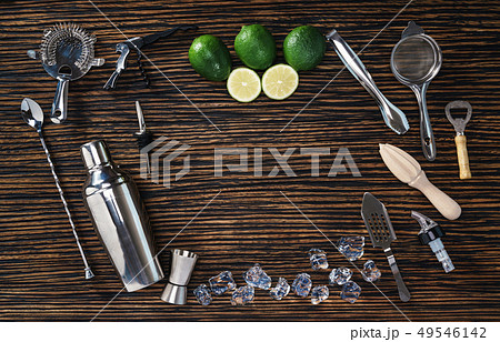 Set of bartending tools and limes 49546142