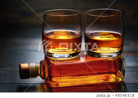 two glasses of whiskey. horizontal composition two glasses of whiskey. horizontal composition 49546318