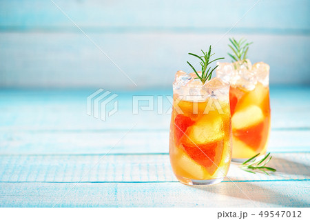 Gin cocktail with rosemary and grapefruit Gin cocktail with rosemary and grapefruit 49547012
