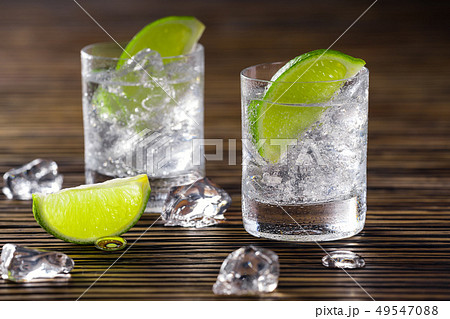 Two shots with gin and tonic 49547088