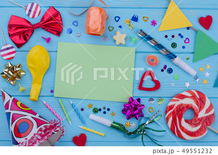 Birthday accessories on blue wood. 49551232