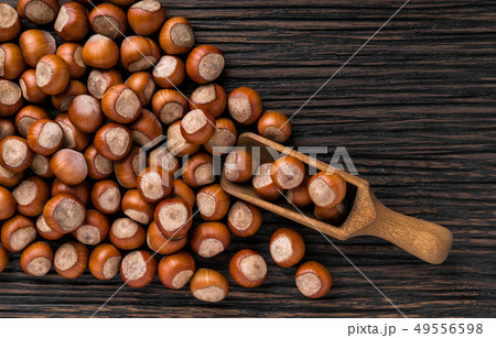 hazelnut on a brown wooden table,top view hazelnut on a brown wooden table,top view 49556598