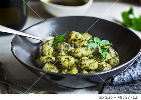 Gnocchi in Pesto sauce 49557712