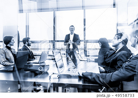 Successful manager leading corporate business team office meeting. Successful manager leading corporate business team office meeting. 49558733