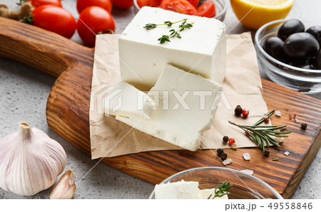 Cubes of feta and spices on board Cubes of feta and spices on board 49558846
