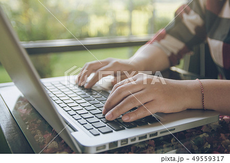 Woman working on laptop. Close up hand 49559317