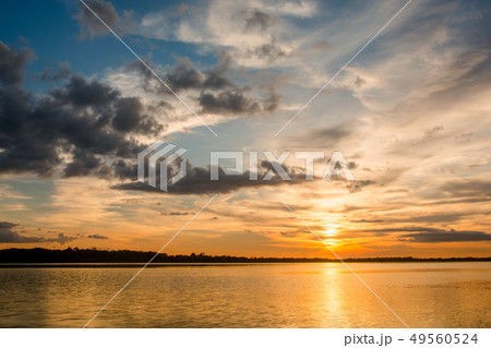 Sunset in the lake. beautiful sunset behind the 49560524