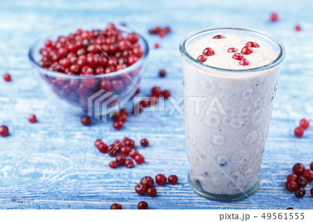 yogurt with cranberries on the table 49561555