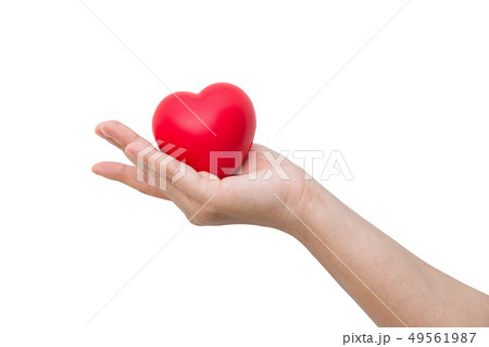 Red heart ball on hand isolated on white  49561987