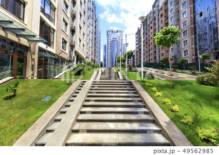 The steps of the granite stairs rise up the slope The steps of the granite stairs rise up the slope 49562985