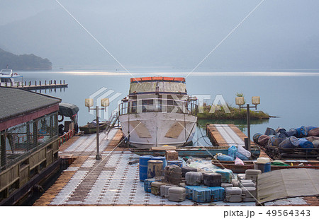 boat and speed boat dock yard in sunrise morning a boat and speed boat dock yard in sunrise morning a 49564343