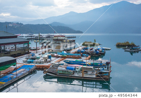 boat and speed boat dock yard in sunrise morning a boat and speed boat dock yard in sunrise morning a 49564344