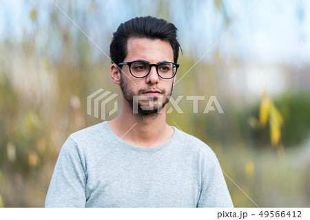 Young student of computer science poses at the campus park near the Polytechnic School Young student of computer science poses at the campus park near the Polytechnic School 49566412