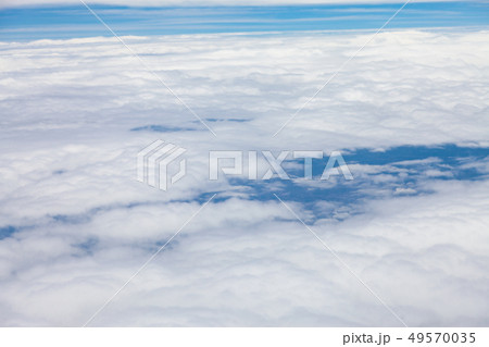 Clouds, sky and ground, looking from the plane. Clouds, sky and ground, looking from the plane. 49570035