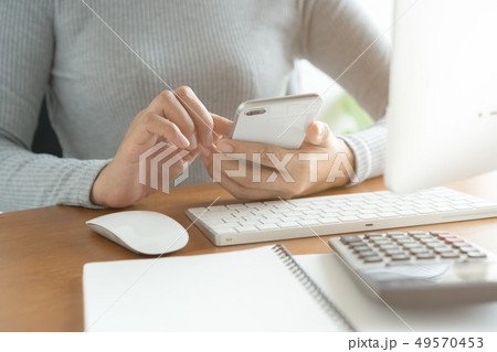 The hand of Asian women are using smartphone The hand of Asian women are using smartphone 49570453