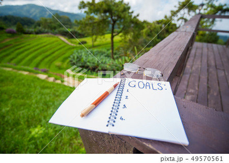 Business plan and goal. Writing on the white paper Business plan and goal. Writing on the white paper 49570561