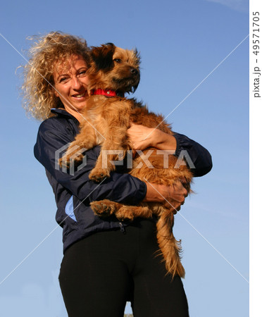 Pyrenean sheepdog and woman Pyrenean sheepdog and woman 49571705
