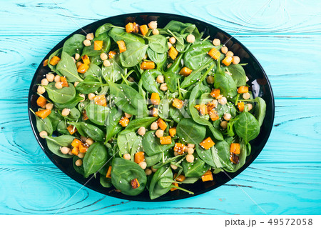 autumn salad with pumpkin , spinach , chickpea and autumn salad with pumpkin , spinach , chickpea and 49572058