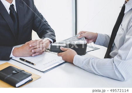 Bribery and corruption concept, bribe in the form Bribery and corruption concept, bribe in the form 49572114