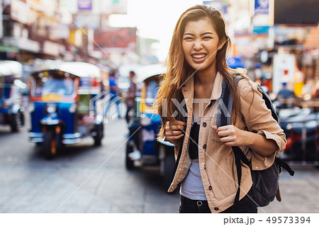 Young tourist walking and sightseeing in Bangkok, Thailand Young tourist walking and sightseeing in Bangkok, Thailand 49573394