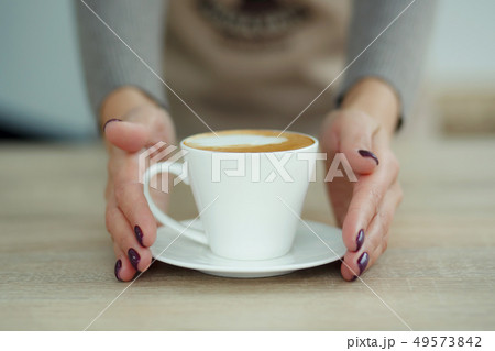 Barista in apron in coffee shop give just brewed 49573842