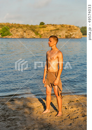 guy in loincloth on the background of river beach guy in loincloth on the background of river beach 49574033