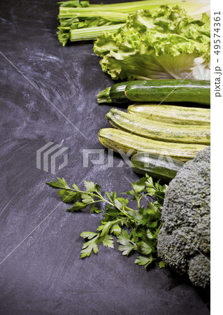 Variety of green vegetables and herbs. Variety of green vegetables and herbs. 49574361