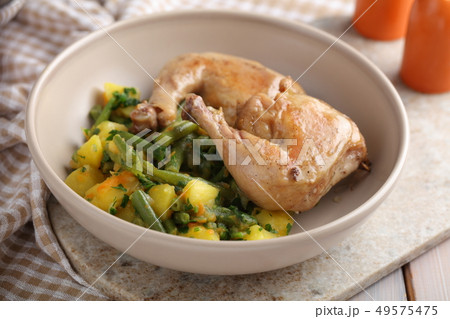 Chicken legs with potatoes and green bean Chicken legs with potatoes and green bean 49575475