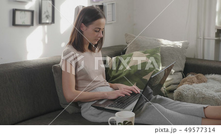 Young woman works in her home office with her laptop 49577314