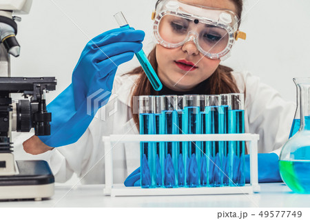 Woman scientist working in chemist laboratory. Woman scientist working in chemist laboratory. 49577749