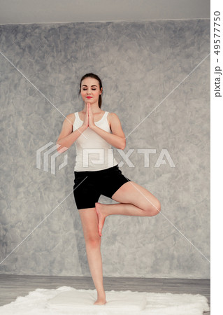 Young woman yoga on carpet at home living room. Young woman yoga on carpet at home living room. 49577750
