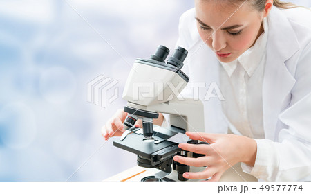 Scientist researcher uses microscope in laboratory 49577774