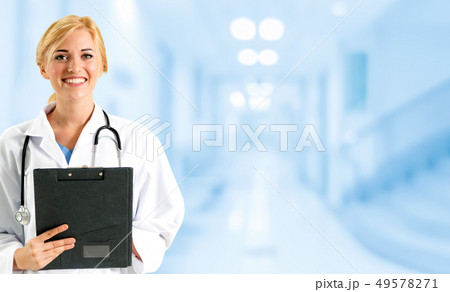 Woman doctor working at the hospital office. 49578271