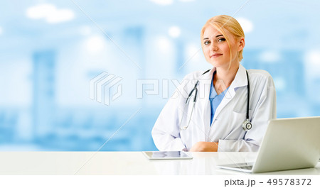 Doctor using laptop computer at the hospital. Doctor using laptop computer at the hospital. 49578372