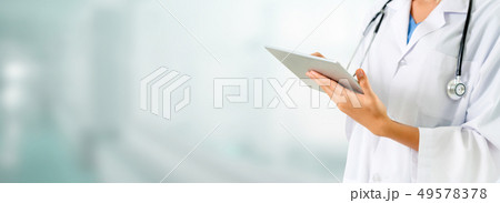 Doctor using tablet computer at the hospital. 49578378