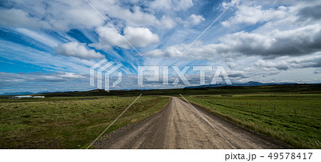 Empty dirt road through countryside landscape. Empty dirt road through countryside landscape. 49578417