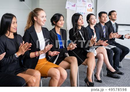 Businessmen and businesswomen celebrating success. 49578598