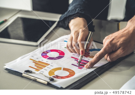 Business people working with business report. Business people working with business report. 49578742