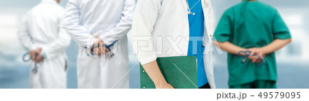 Doctor working in hospital with other doctors. Doctor working in hospital with other doctors. 49579095