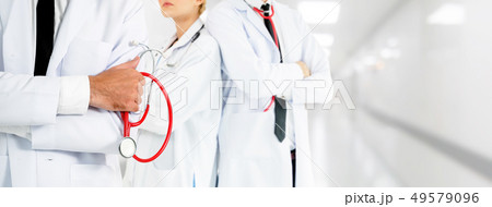 Doctor working in hospital with other doctors. 49579096