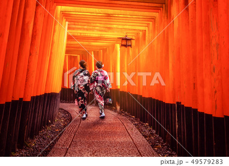 Traveler in Fushimi Inari Shrine, Kyoto, Japan Traveler in Fushimi Inari Shrine, Kyoto, Japan 49579283