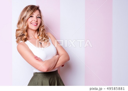 Cute natural blonde woman smiling with perfect white teeth and glowing skin. Smiling young blond 49585881