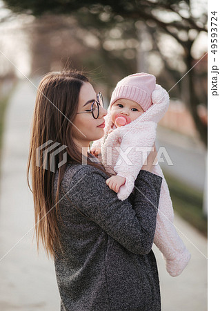Portrait of mother and her little baby girl. Beautiful mom and cute baby. Mother hud her daughter 49593724