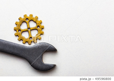 Top closeup view of gear wheel on white background with blank space for text. Top view, flat lay. 49596800