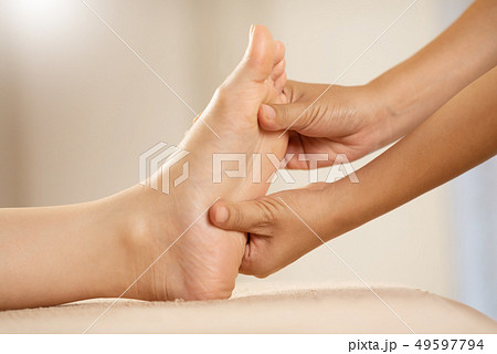 Foot Massage at the spa salon. Foot Massage at the spa salon. 49597794
