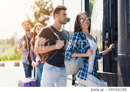 Group of Young People Boarding on Travel Bus Group of Young People Boarding on Travel Bus 49598186