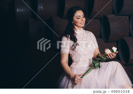 March 8: beautiful girl in a light dress with 49601038