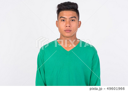 Young Asian man looking at camera against white background 49601966